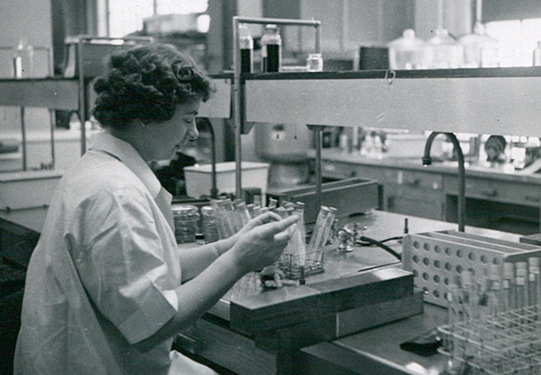 Female scientist working in a lab in the 1950s